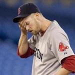 Boston Red Sox pitcher Daniel Bard reacts after walking-in the tying run in the eighth inning of a baseball game against the Toronto Blue Jays in Toronto Wednesday, Sept. 7, 2011. The Blue Jays defeated the Red Sox 11-10. (AP Photo/The Canadian Press, Darren Calabrese)